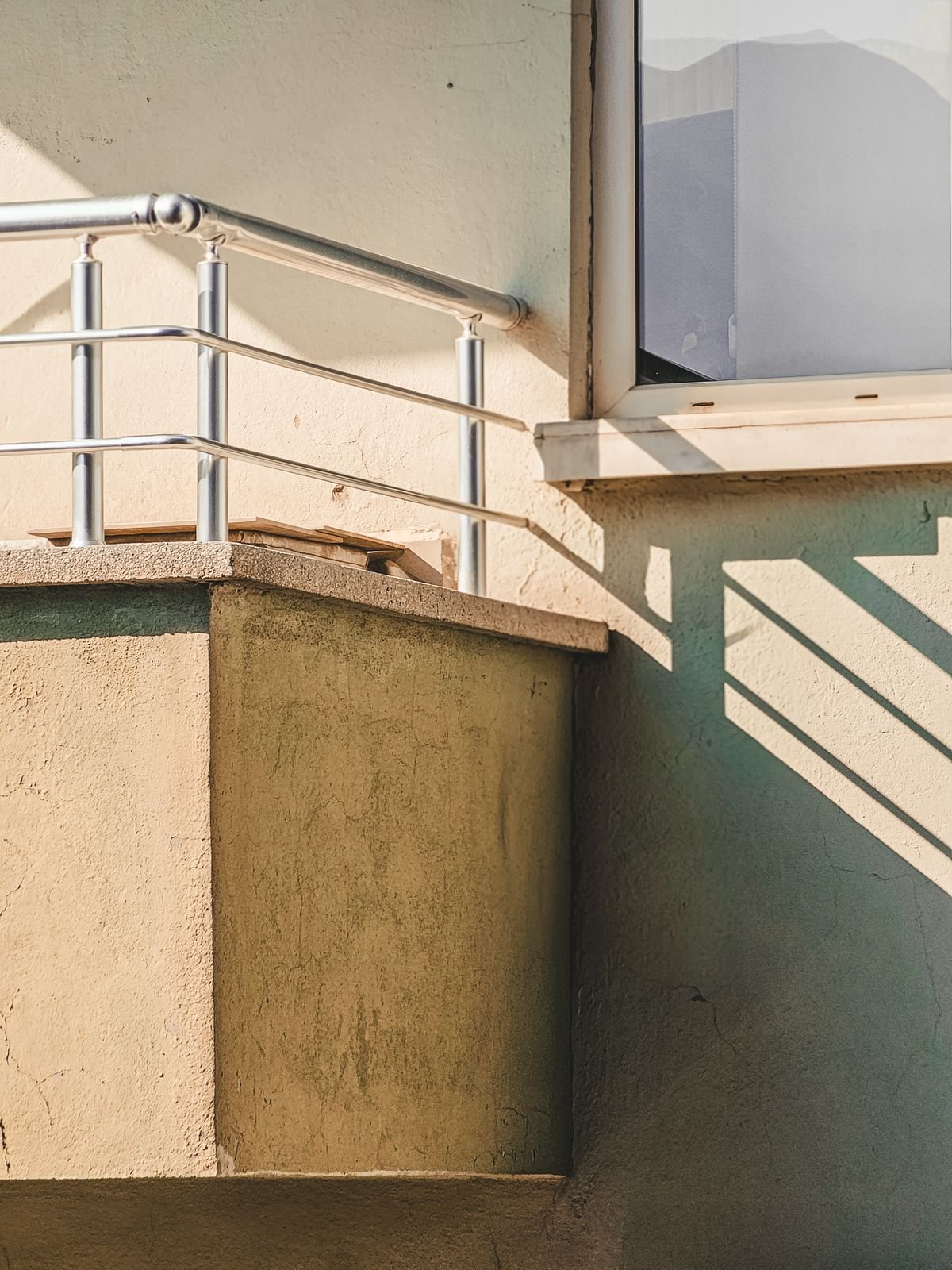 Balcony invisible grills on a Rushikonda tower, Visakhapatnam — stainless track and capped ends